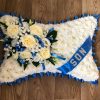 White Pillow with Coloured Corsage
